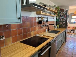 a kitchen with a sink and a counter top at Villa with privat pool La Bisbal in Vulpellach