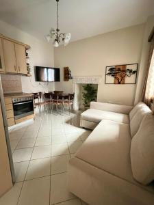 a living room with a couch and a table at Lagom House in Panagia