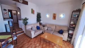 a living room with two couches and a table at Hermitage 103 in Torroella de Montgrí