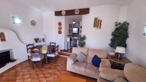 a living room with a couch and a table at Hermitage 103 in Torroella de Montgrí