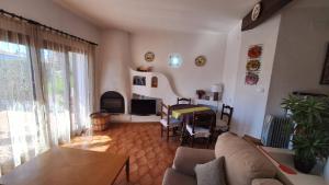 a living room with a couch and a table at Hermitage 103 in Torroella de Montgrí +22 photos