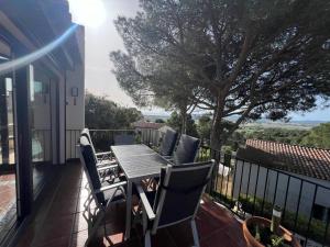a table and chairs on the balcony of a house at Torre Vella 66 in Torroella de Montgrí +16 photos