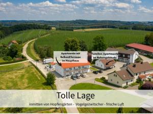 an aerial view of a small village with a building at Holledau-Apartments - Auszeit im schönen Hopfenland in Bayern - voll ausgestattete Apartments - Garten - Balkon - Nähe München in Osterwaal