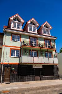 a building on the corner of a street at Helena in Karwia