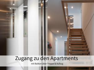 a stairway in a building with the words zig zagging at Holledau-Apartments - Auszeit im schönen Hopfenland in Bayern - voll ausgestattete Apartments - Garten - Balkon - Nähe München in Osterwaal +50 photos