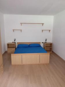 a bedroom with a bed and two night stands at Il rifugio della Presolana in Castione della Presolana