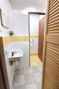 a bathroom with a sink and a shower at Chata Kopánka in Moderštôlňa +20 photos