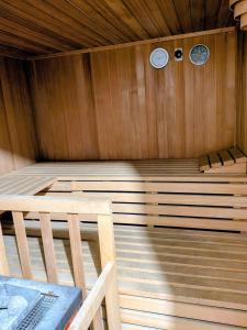 a inside of a sauna with a bench in it at Sunshine Suite in Ingenbohl