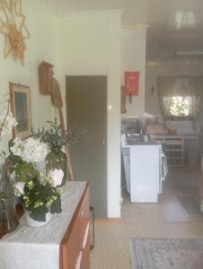 a kitchen with a counter with flowers on it at Guest Room in Liviöjärvi