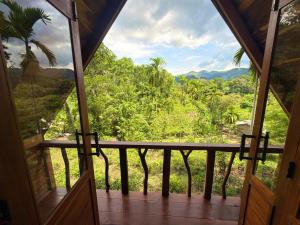 a view from the inside of a room with a window at Mr Arachchi Luxury Cabana in Ella