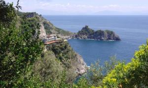 a train on top of a mountain near the ocean at Albergo La Conca Azzurra in Conca dei Marini