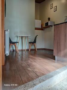 a dining room with a table and two chairs at Casa dos Ramos in Rio de Fornos +21 photos