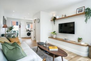 a living room with a couch and a table at Cottage 298 - Clifden in Clifden