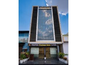 a hotel view of the front of a building at Hotel Venus Inn in Indore
