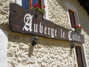 a sign on the side of a building at Auberge le Collet in Saint-Agnan-en-Vercors