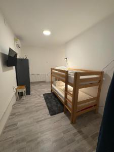 a bedroom with a bunk bed in a room at City Walk Hostel Zagreb in Zagreb