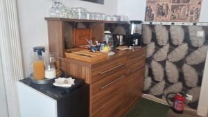 a kitchen with a wooden counter with a counter top at Butterfly Home Danube in Budapest