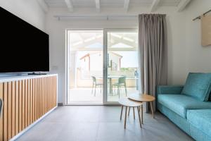 a living room with a couch and a table at Borgo Myricae in Chia