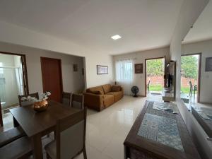 a living room with a couch and a table at Casa Villa Serrano in Lençóis