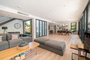 a living room with a couch and a table at Villa SP1 Suites Santa Ponsa by Sealand Villas in Santa Ponsa