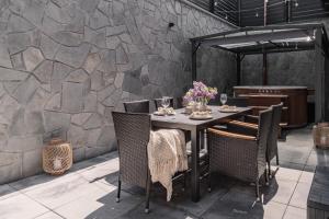 a dining room with a table and chairs at JW Apartments in Krościenko