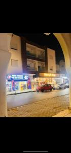 a car parked in front of a building at night at two-bedroom apartment with a living room, kitchen and balcony in Monastir