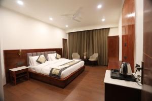 a hotel room with a bed and a desk at The Pamir Hotel in Nubra