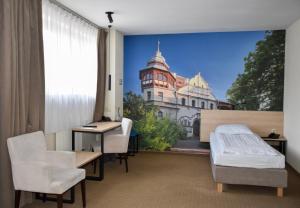 a hospital room with a view of a building at Iness Hotel in Łódź +56 photos