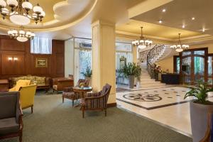 a lobby with a staircase and a living room at Crystal Palace Boutique Hotel in Sofia