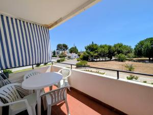 a balcony with a table and chairs and a view at 06 Sra da Rocha - Casas & Papeis in Porches