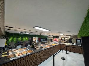 a buffet line with many different types of food at Chalet 173 in Gura Humorului +67 photos