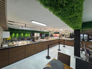 a restaurant with a buffet line of food at Chalet 173 in Gura Humorului