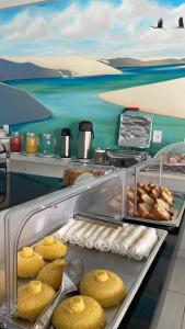 a bakery with muffins and other pastries on display at Pousada Brilho dos Lençóis in Barreirinhas