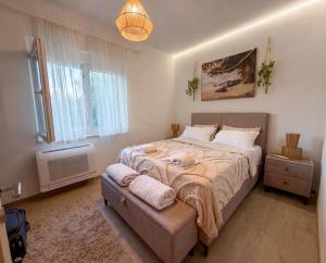 a bedroom with a large bed and a window at Villa Aurea Luxury Sunset with Pool in Krimovice +34 photos