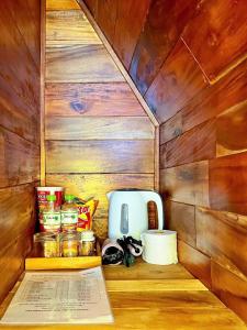 a small kitchen with a counter with food and a toaster at Waikiki Lagi Beach in Ấp Tam Tân
