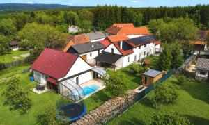 an aerial view of a house with a swimming pool at Podbrdská chalupa in Nechanice
