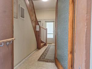 a hallway with a door open to a hallway with a rug at Villa Doll Germersheim in Germersheim