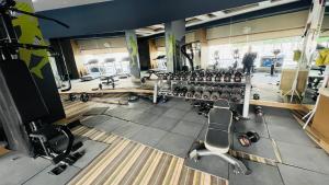 an overhead view of a gym with rows of equipment at The Comfort stays gomti nagar in Lucknow