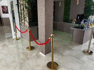 a red ribbon is tied to a pillar in a building at Hotel Schöne Altmark in Kalbe