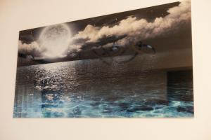 a painting of a bath tub with a moon at Numero Uno LUX in Sombor +64 photos