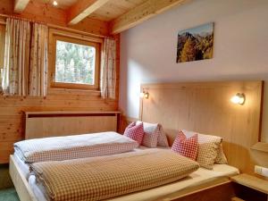 Кровать или кровати в номере Landhaus Hubert Fiegl