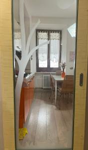 a kitchen and dining room with a table and chairs at Vicolo in Fiore House in Orvieto
