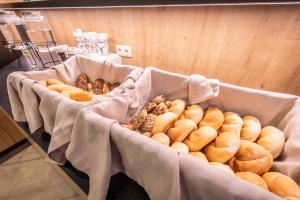 a bunch of different types of donuts in boxes at Hotel Post by keyone in Bad Mitterndorf +60 photos