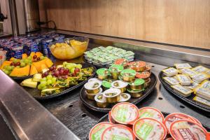 a buffet line with many different types of food at Hotel Post by keyone in Bad Mitterndorf
