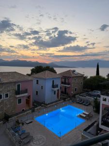 a large swimming pool in the middle of a building at Reis Villa in Nikiana