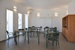 a group of tables and chairs in a room at Dimora Thalèa - Retreat & Rooms in Nardò