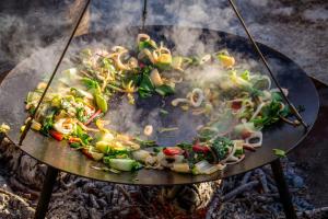 a plate of food cooking on a grill at Nøddehaven in Eg