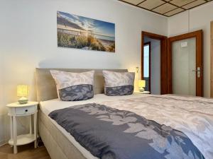 a bedroom with a king sized bed in a room at Gästehaus in Bad Sülze +7 photos