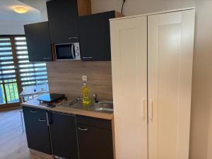 a kitchen with a sink and a counter top at NEU! Ferienappartement Nino in Rötz
