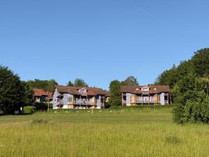 a group of large houses in a field at NEU! Ferienappartement Nino in Rötz